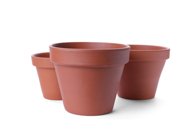 Photo of Stylish terracotta flower pots isolated on white