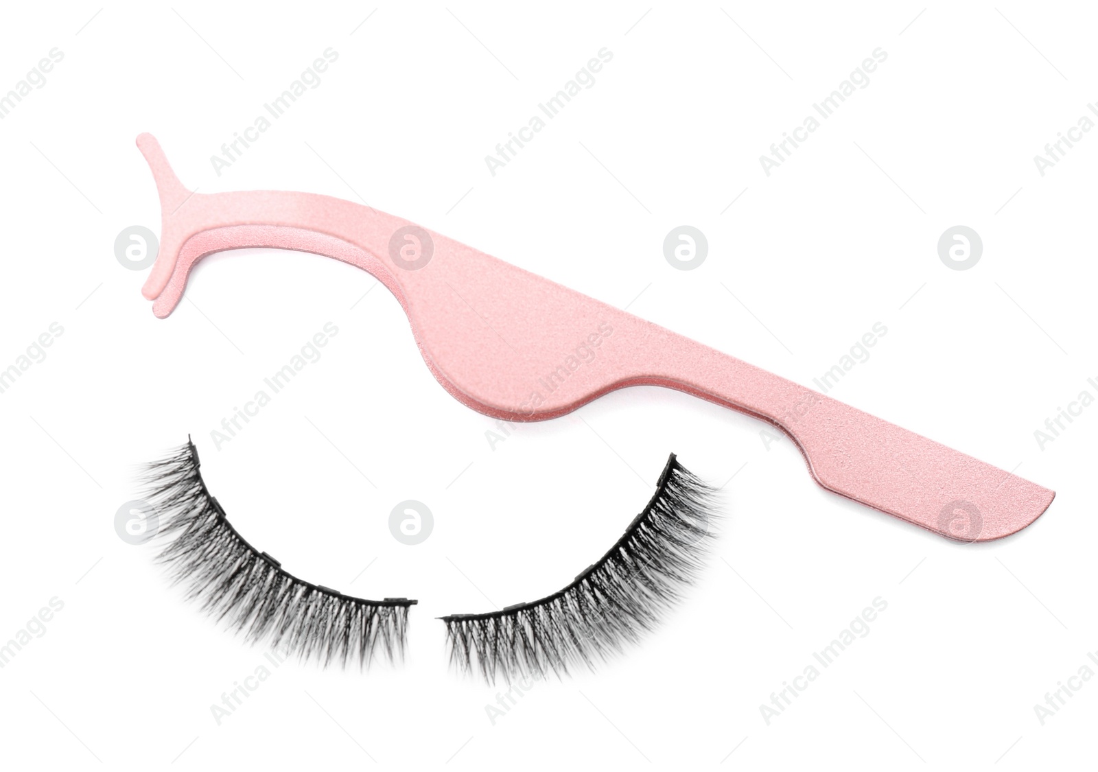 Photo of Magnetic eyelashes and tweezers on white background