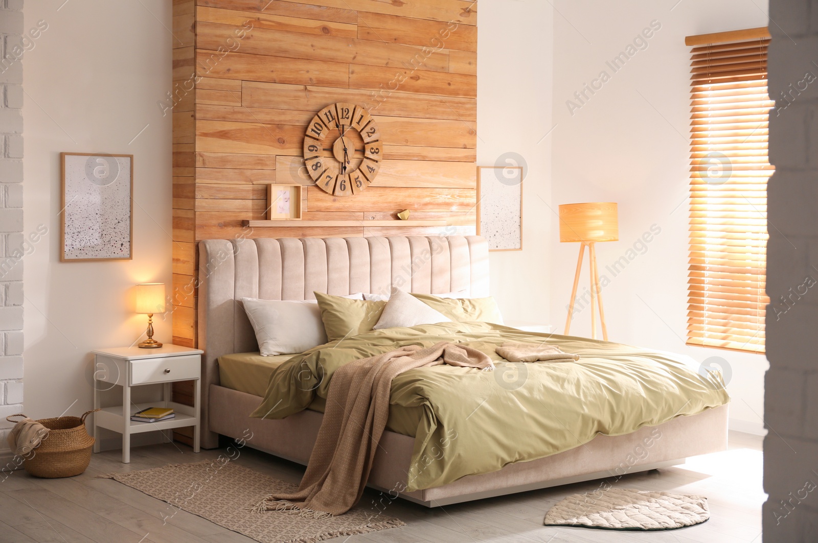 Photo of Comfortable bed with new pistachio linens in modern room interior