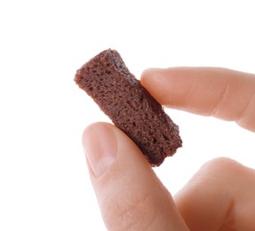 Photo of Woman holding crispy rusk on white background, closeup