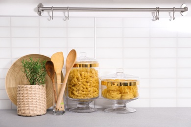 Products and modern kitchen utensils on table