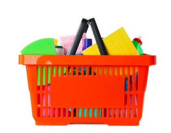 Shopping basket full of detergents on white background