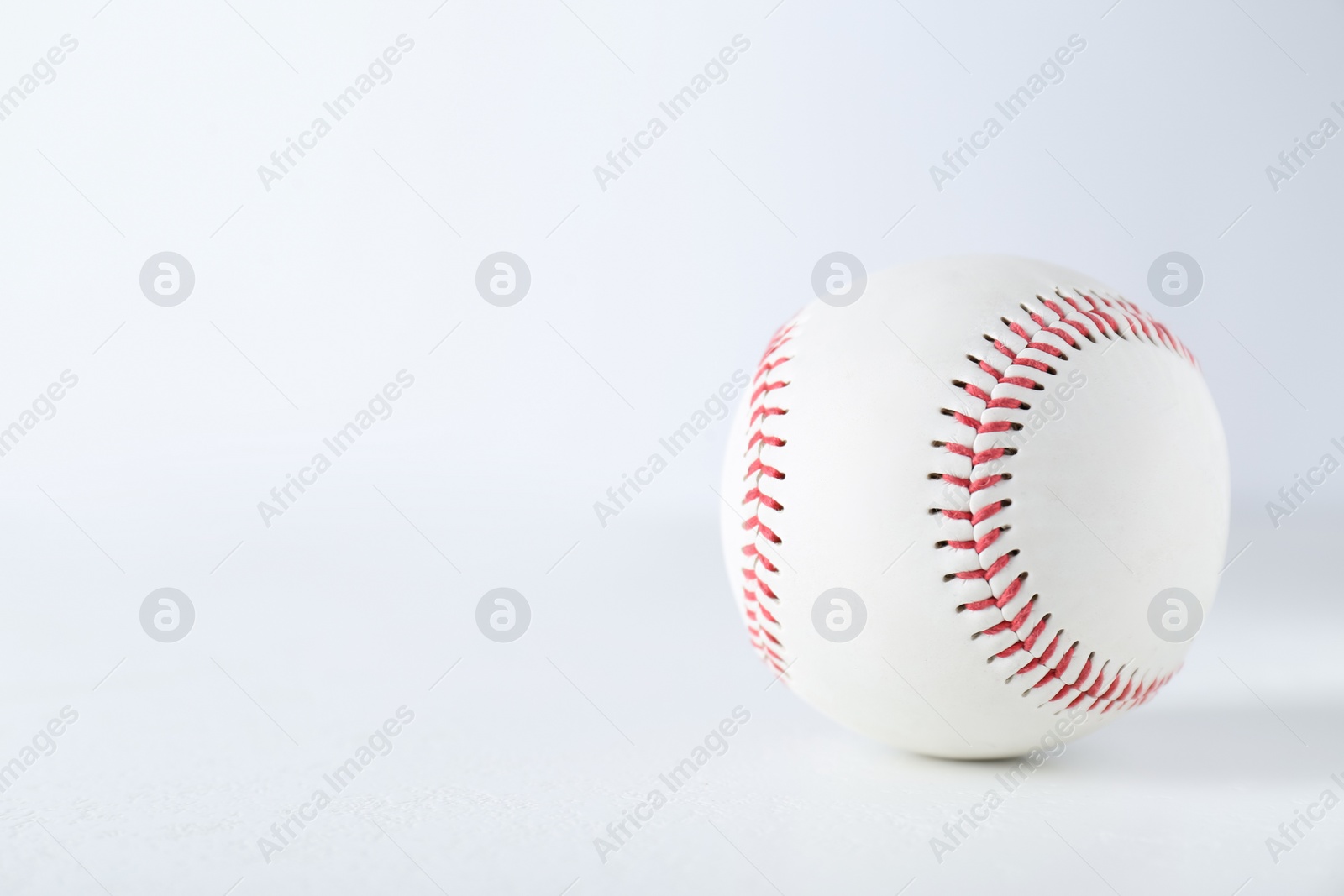 Photo of Baseball ball on white background, closeup with space for text. Sports game