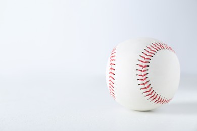 Photo of Baseball ball on white background, closeup with space for text. Sports game