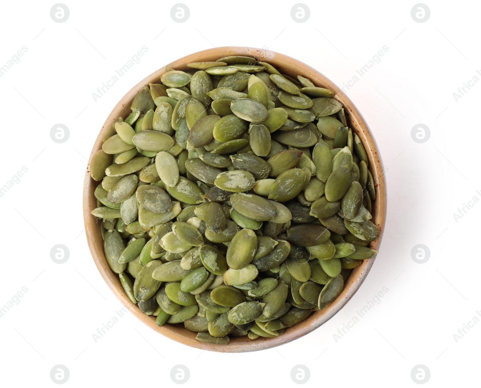 Photo of Shelled raw pumpkin seeds in bowl on white background, top view