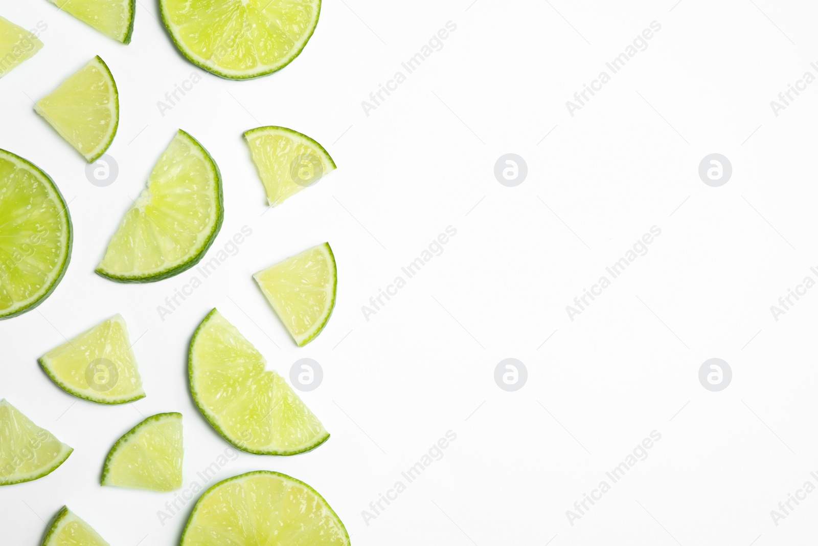 Photo of Juicy fresh lime slices on white background, top view