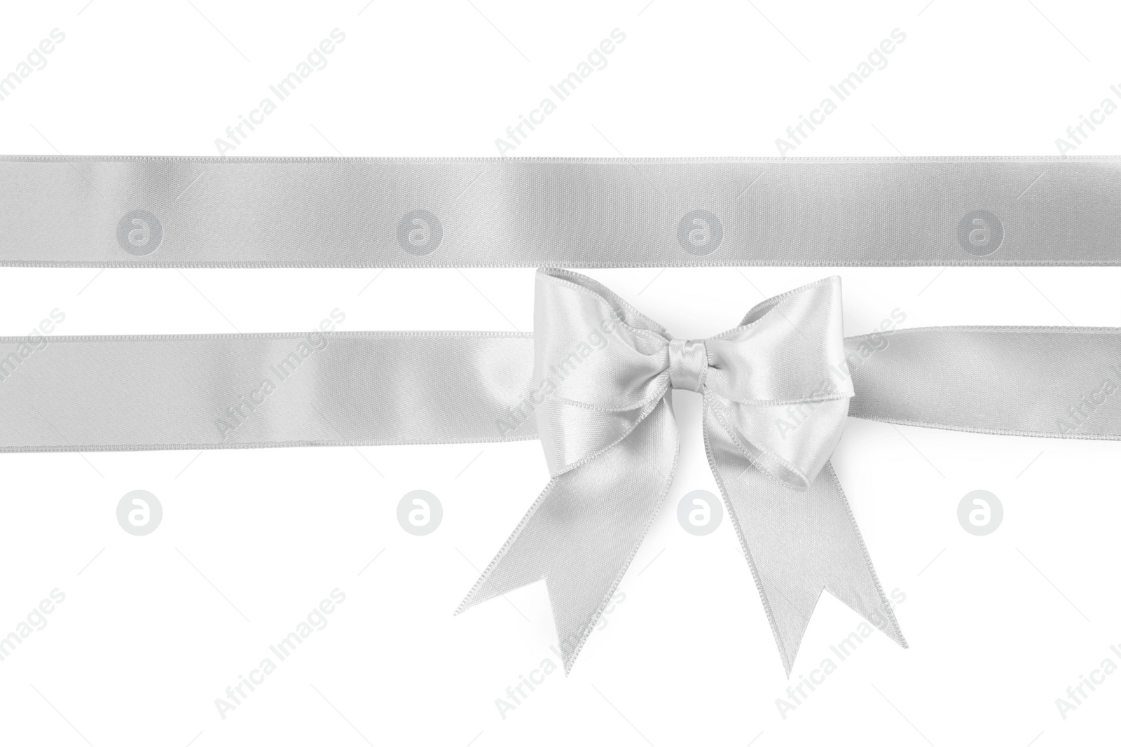 Photo of Silver satin ribbons with bow on white background, top view