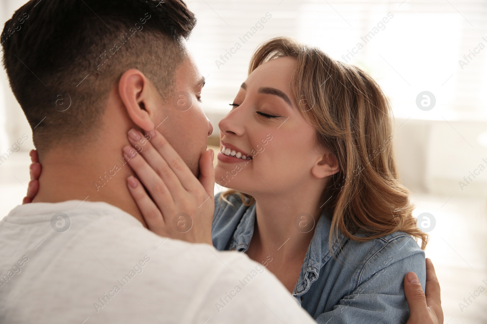 Photo of Lovely couple enjoying time together at home