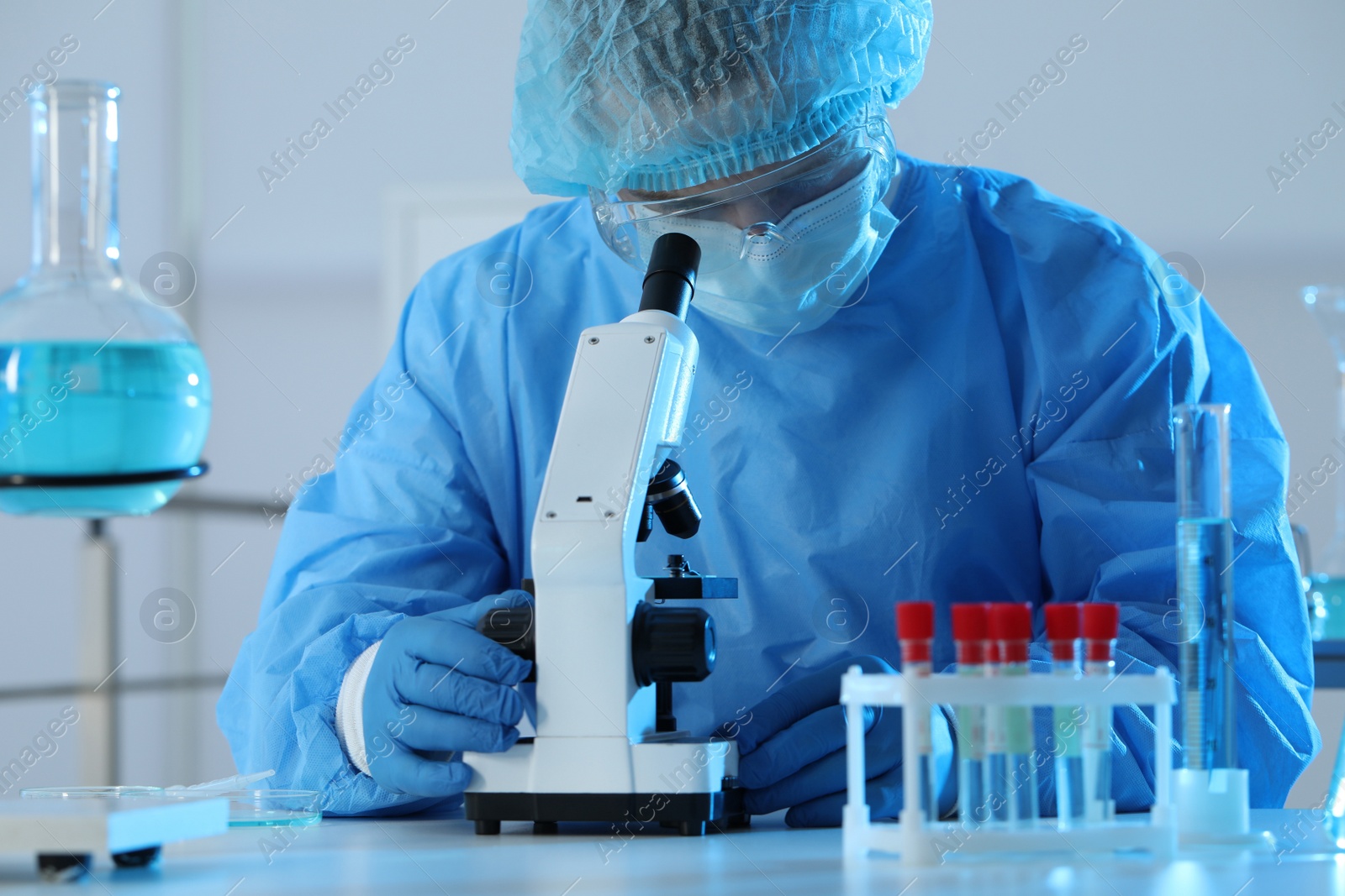 Photo of Scientist working with microscope in laboratory. Medical research