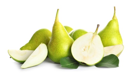 Whole and sliced pears on white background