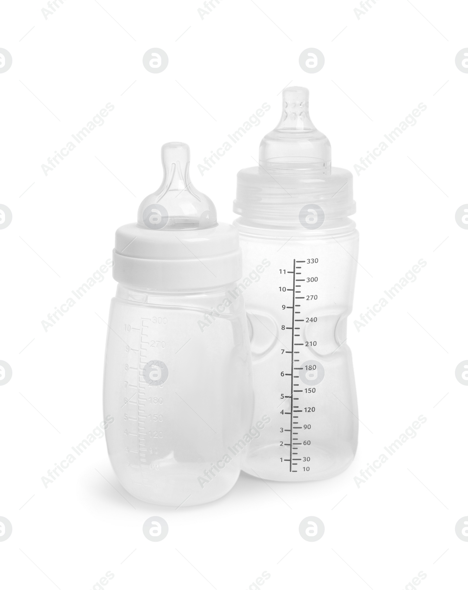 Photo of Two empty feeding bottles for infant formula on white background