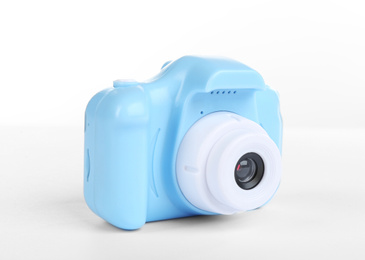 Light blue toy camera isolated on white