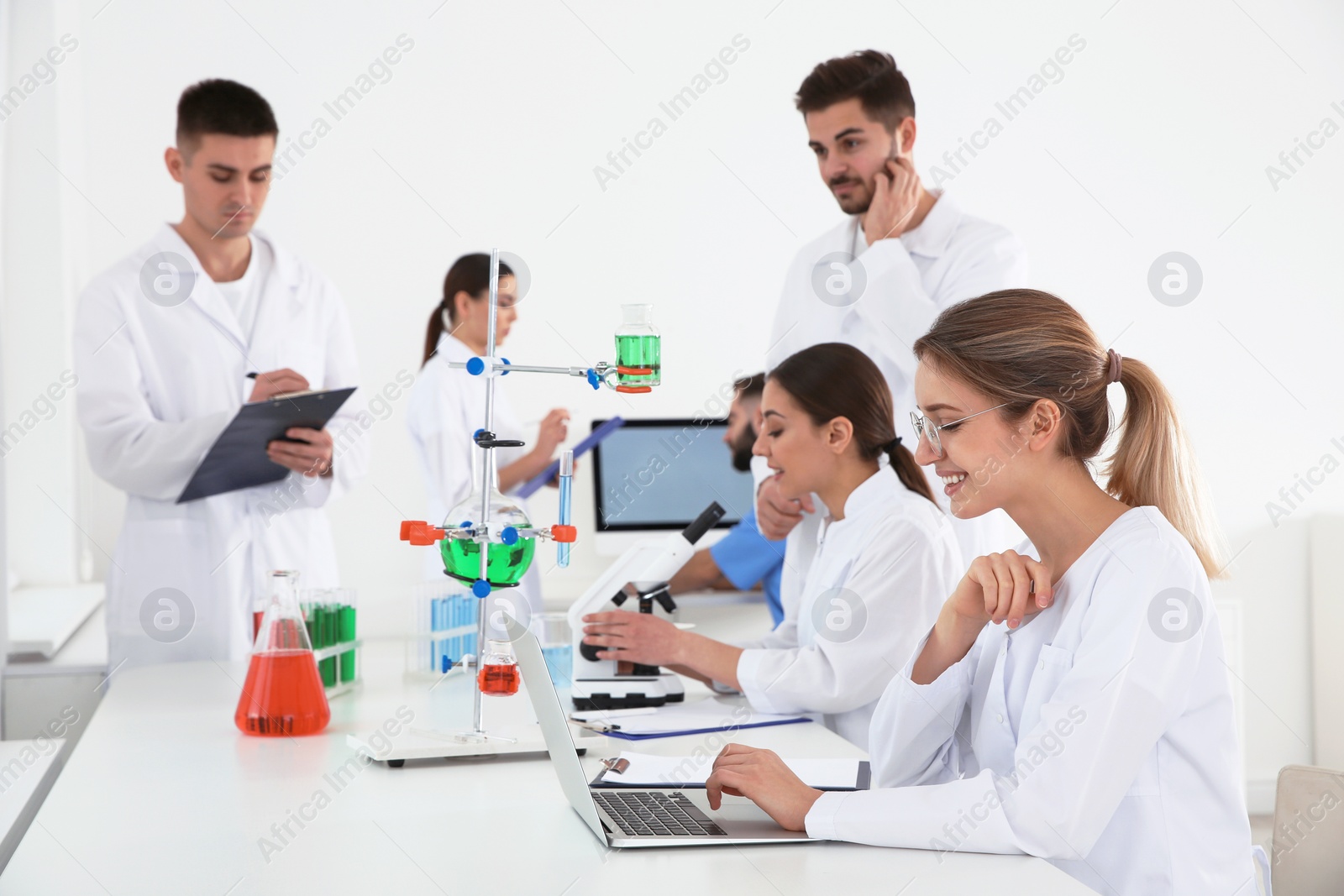 Photo of Medical students working in modern scientific laboratory