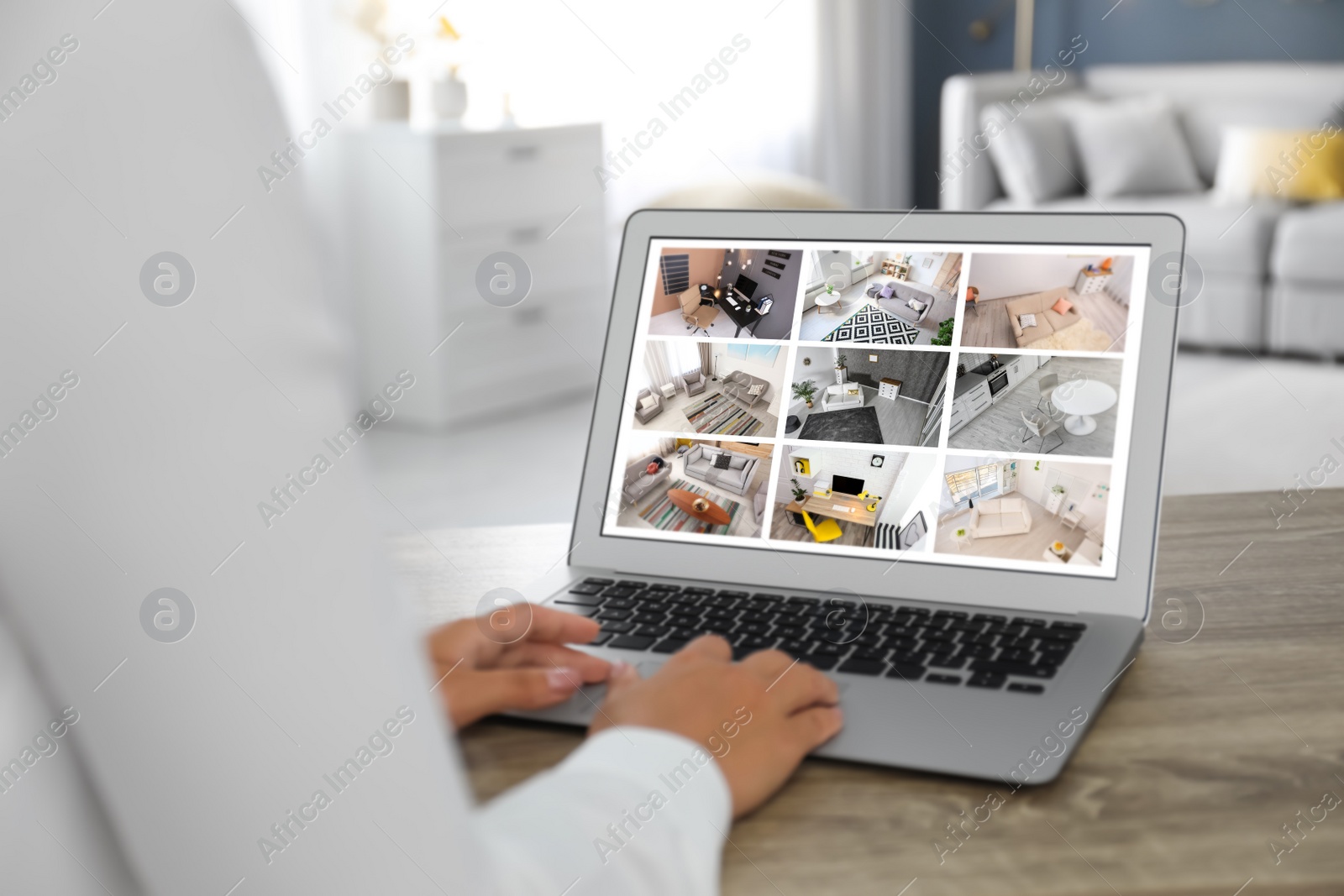 Image of Woman monitoring CCTV cameras at table, closeup. Smart home security system