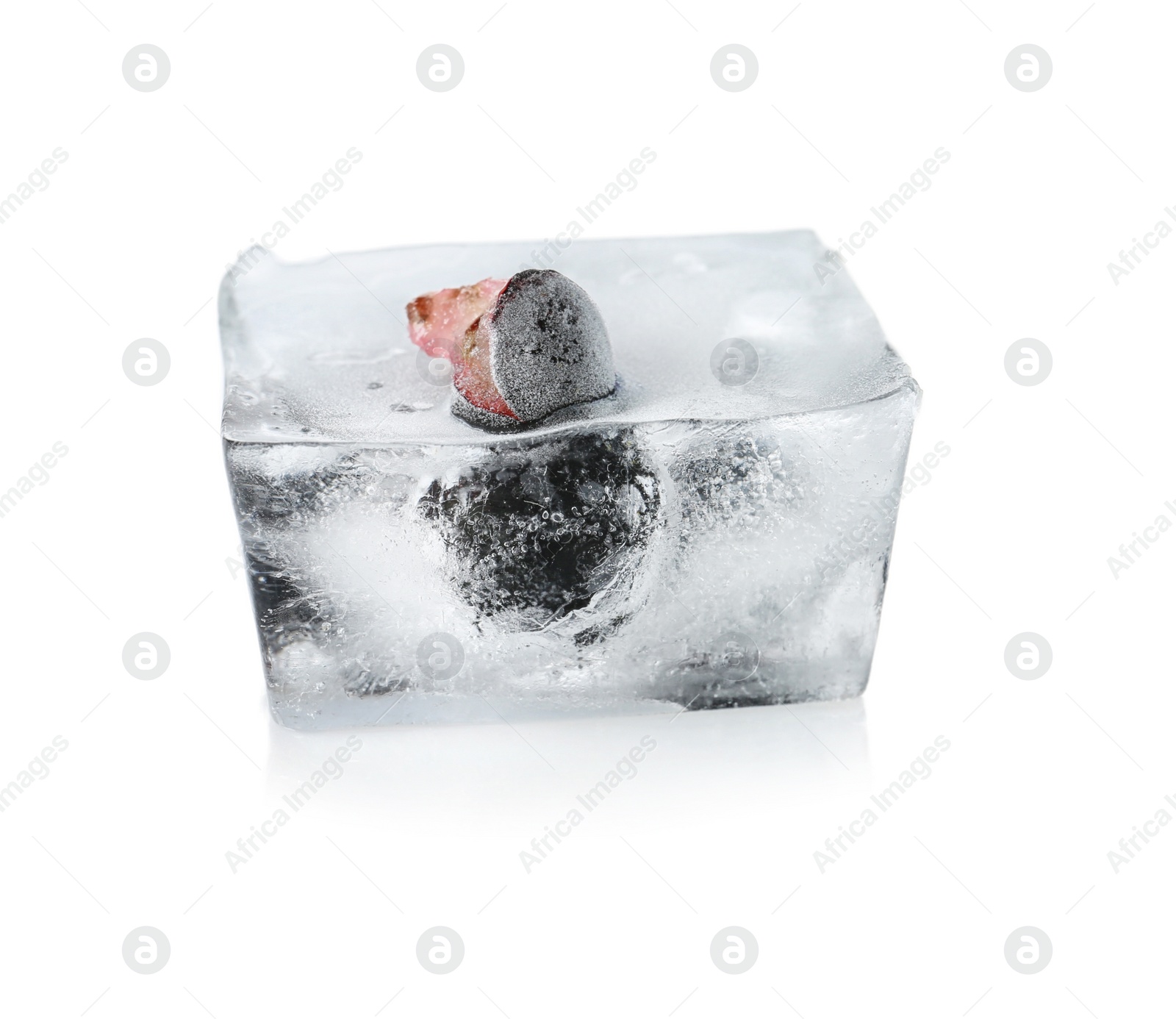 Photo of Raw berries frozen in ice cube on white background