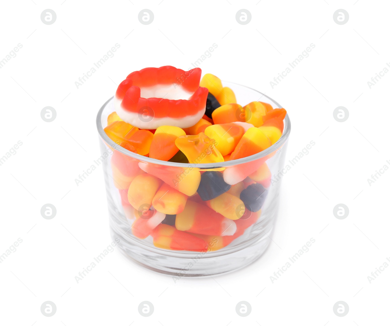 Photo of Glass bowl of delicious colorful candies isolated on white. Halloween sweets
