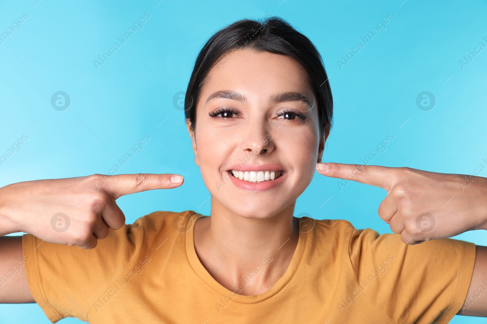 Photo of Young woman with healthy teeth on color background