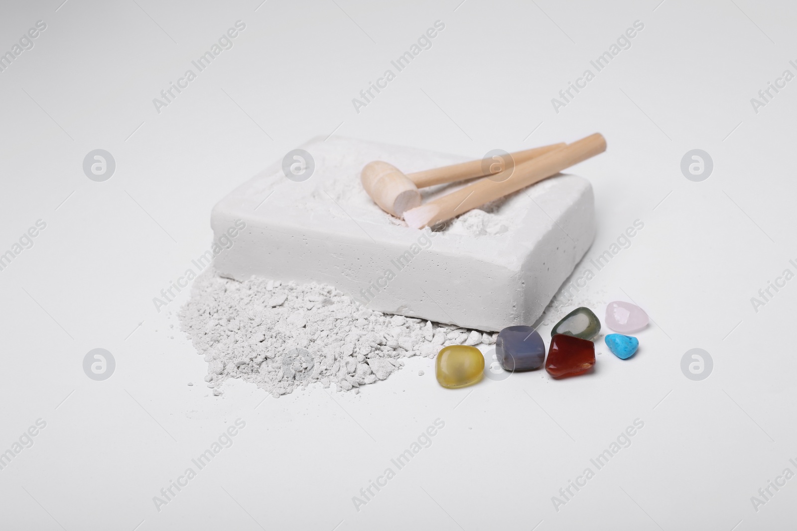 Photo of Excavation kit on white background. Educational toy for motor skills