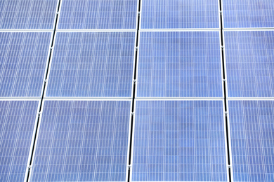 Photo of Installed solar panels as background, closeup. Alternative energy source