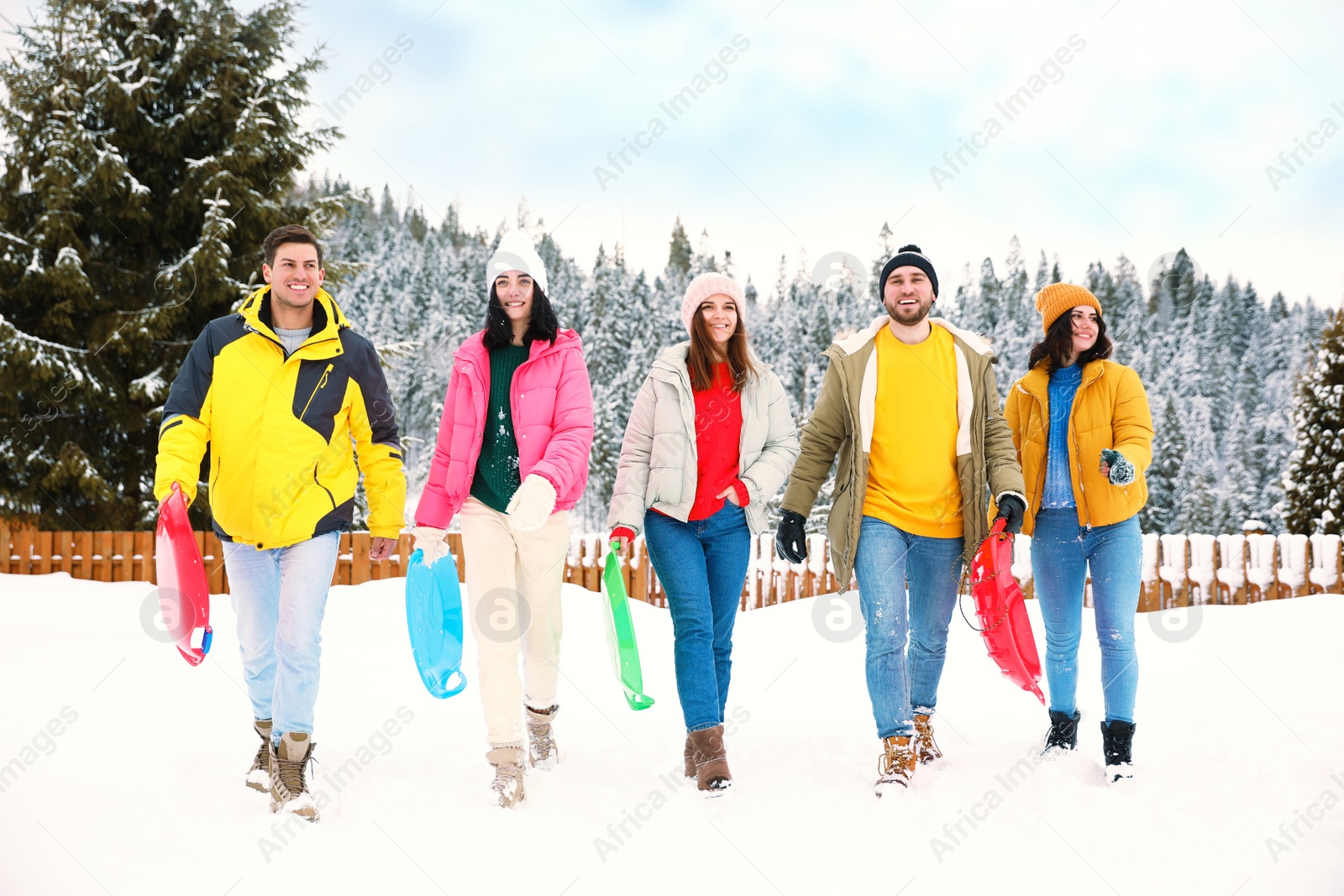 Photo of Group of friends outdoors on snowy day. Winter vacation