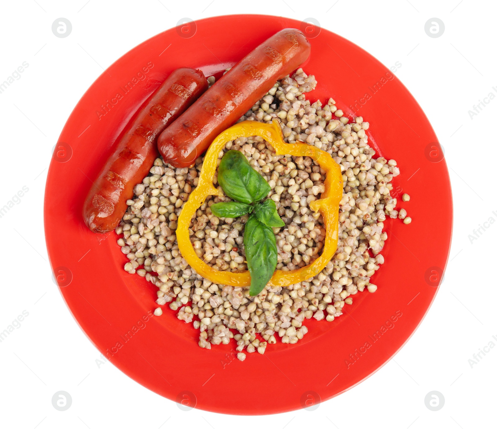 Photo of Tasty buckwheat porridge with sausages isolated on white, top view