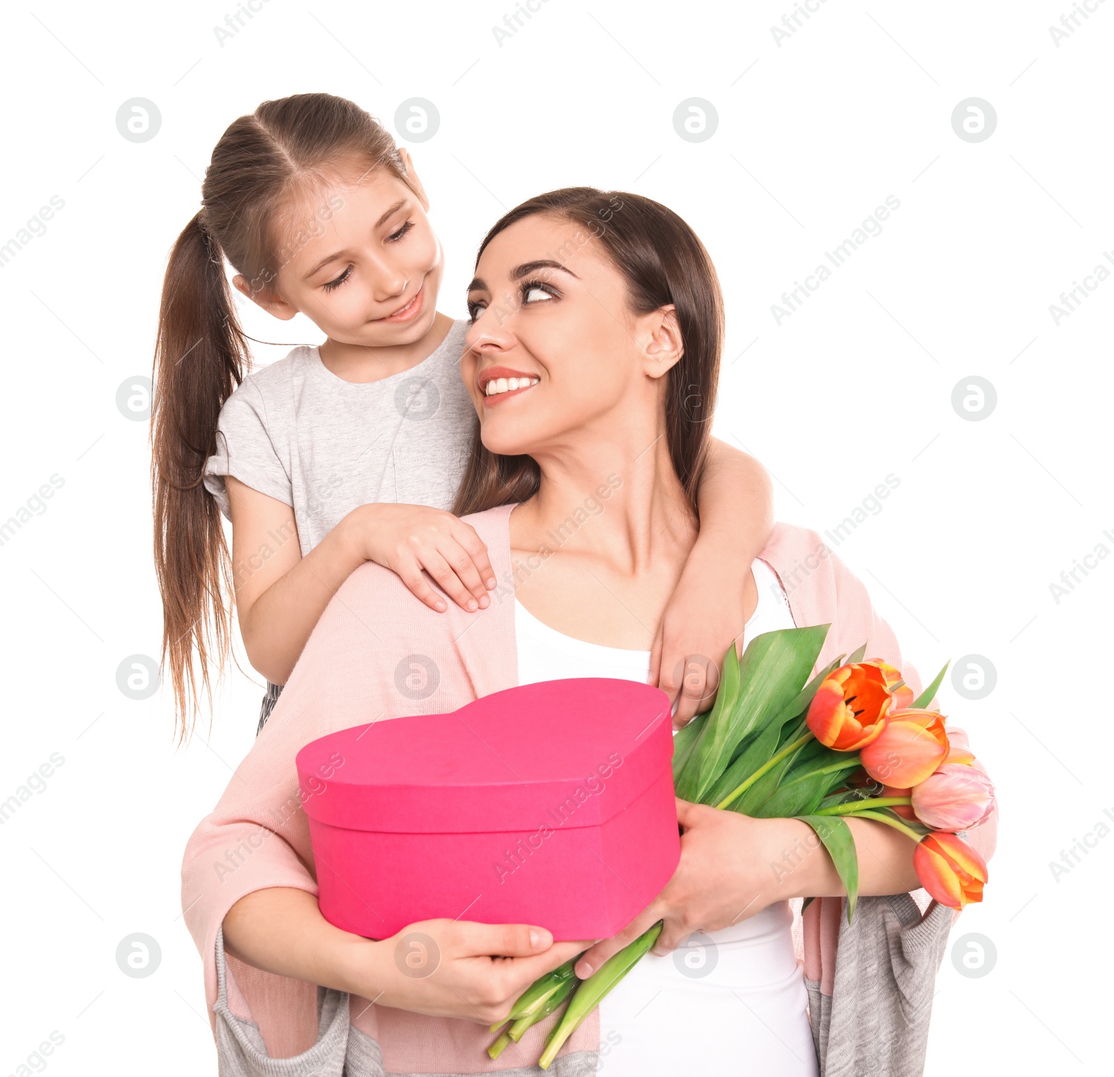 Photo of Portrait of happy woman with gifts and her daughter on white background. Mother's day celebration