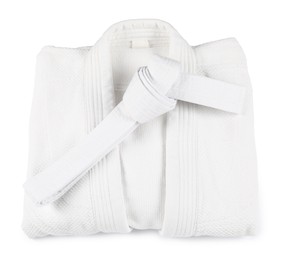 Photo of Karate belt and kimono on white background, top view