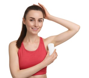 Beautiful woman applying deodorant on white background