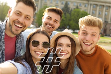 Hashtag icon and group of happy people taking selfie outdoors on sunny day
