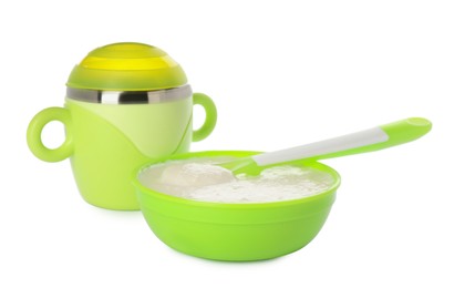 Photo of Healthy baby food in bowl and drink on white background