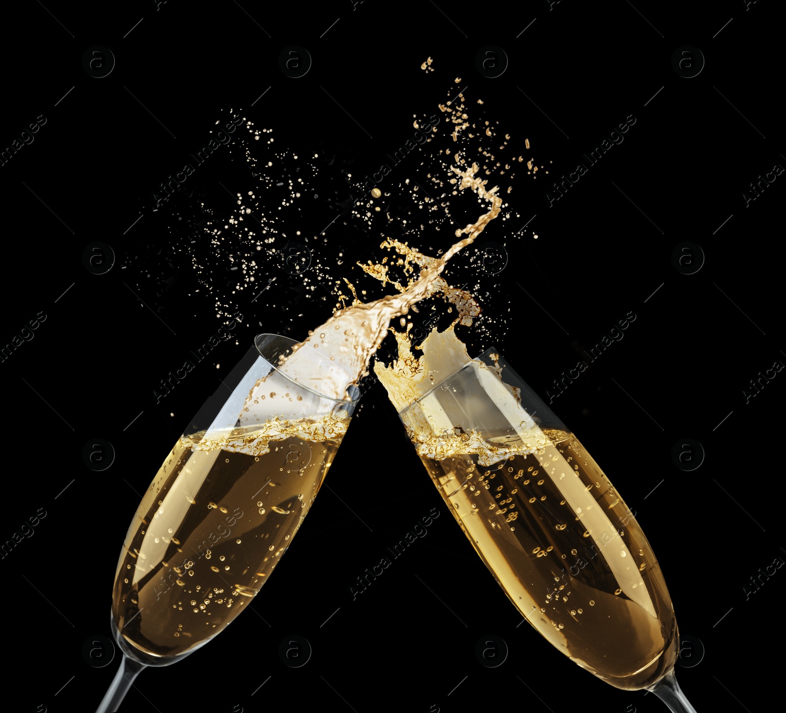 Image of Clinking glasses of sparkling wine with splash on black background