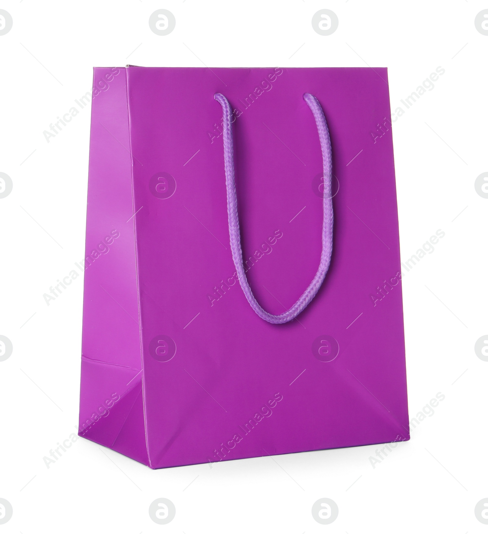 Photo of One violet shopping bag isolated on white