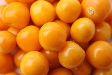 Photo of Fresh ripe physalis fruits as background, closeup view