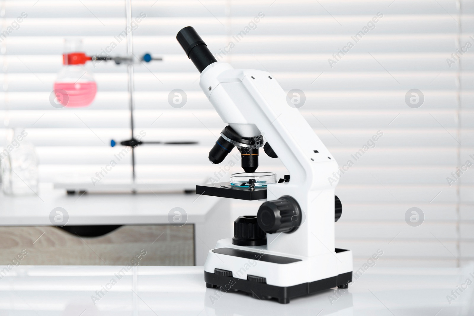 Photo of Laboratory analysis. Modern medical microscope on white table indoors