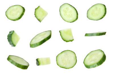 Image of Set of fresh cucumber slices on white background