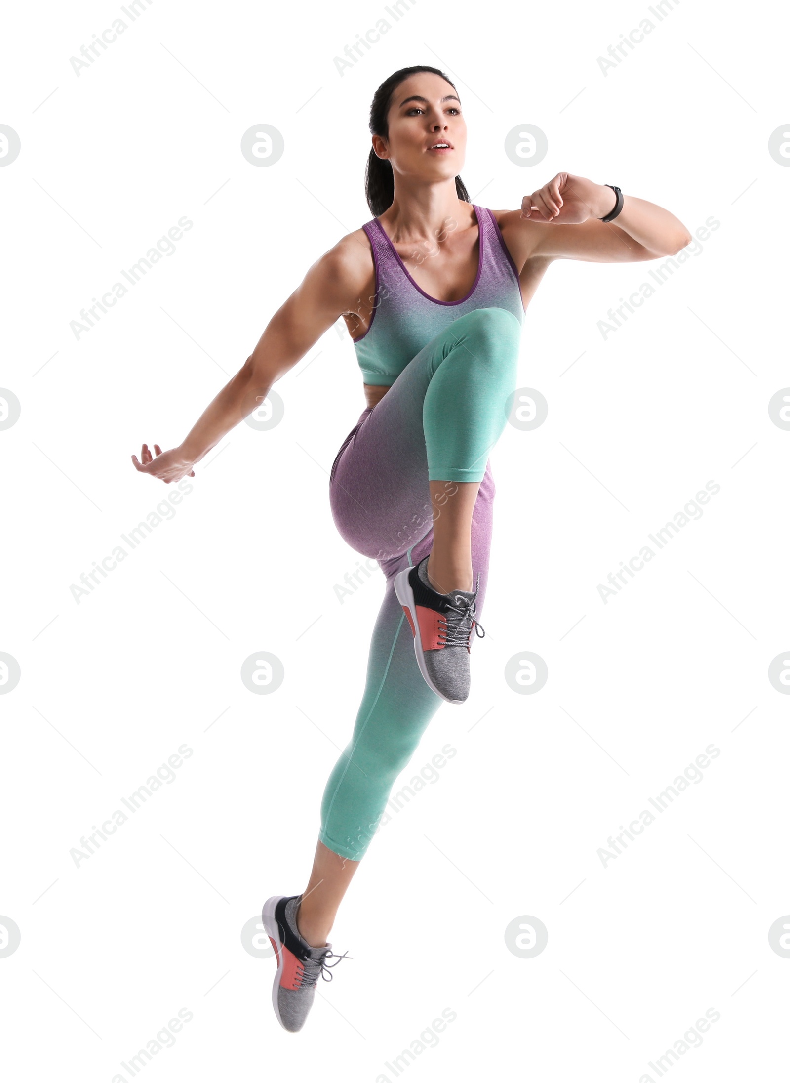 Photo of Athletic young woman running on white background