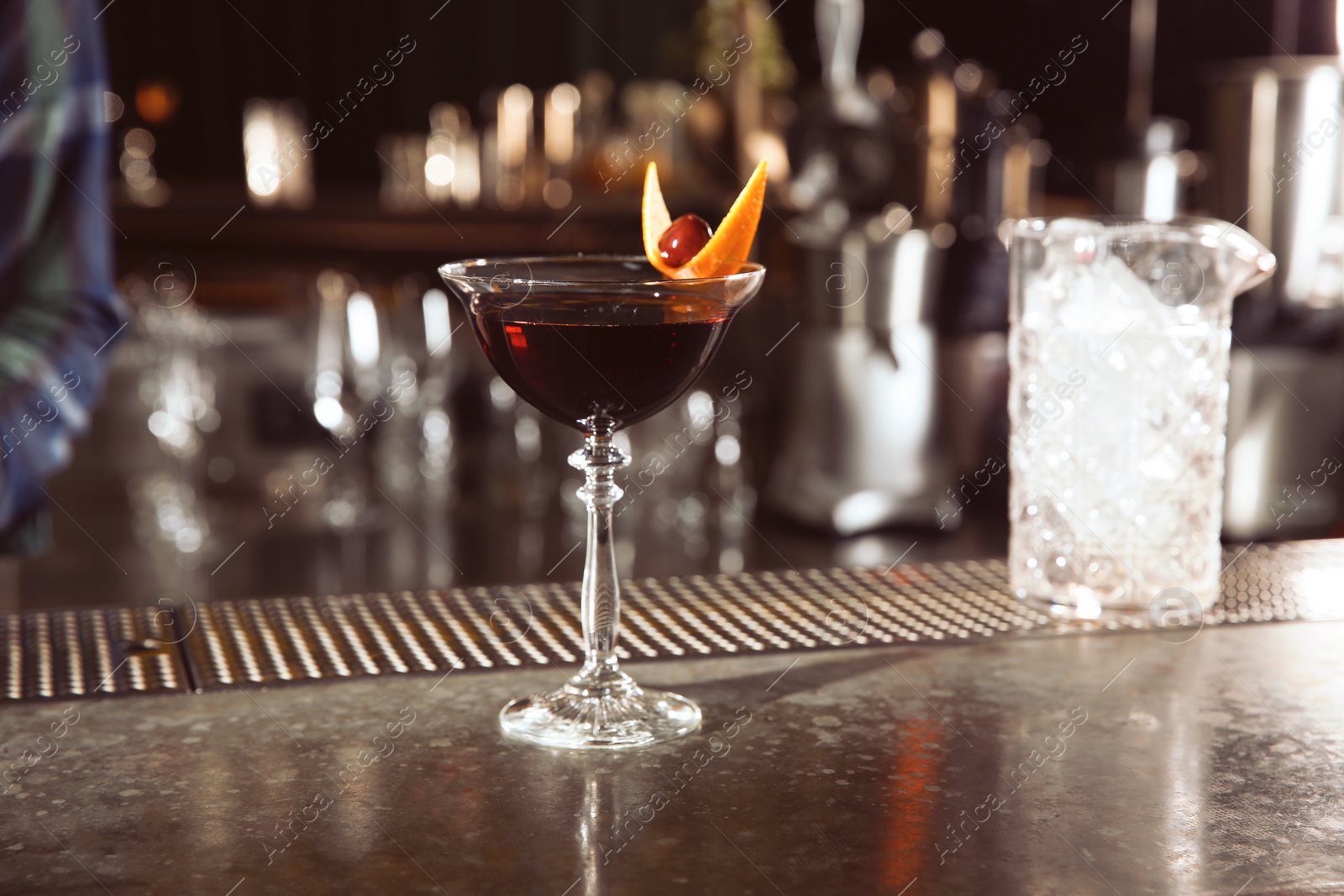 Photo of Fresh alcoholic Manhattan cocktail on bar counter