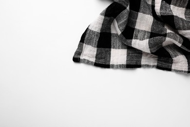 Photo of Black checkered tablecloth on white background, top view
