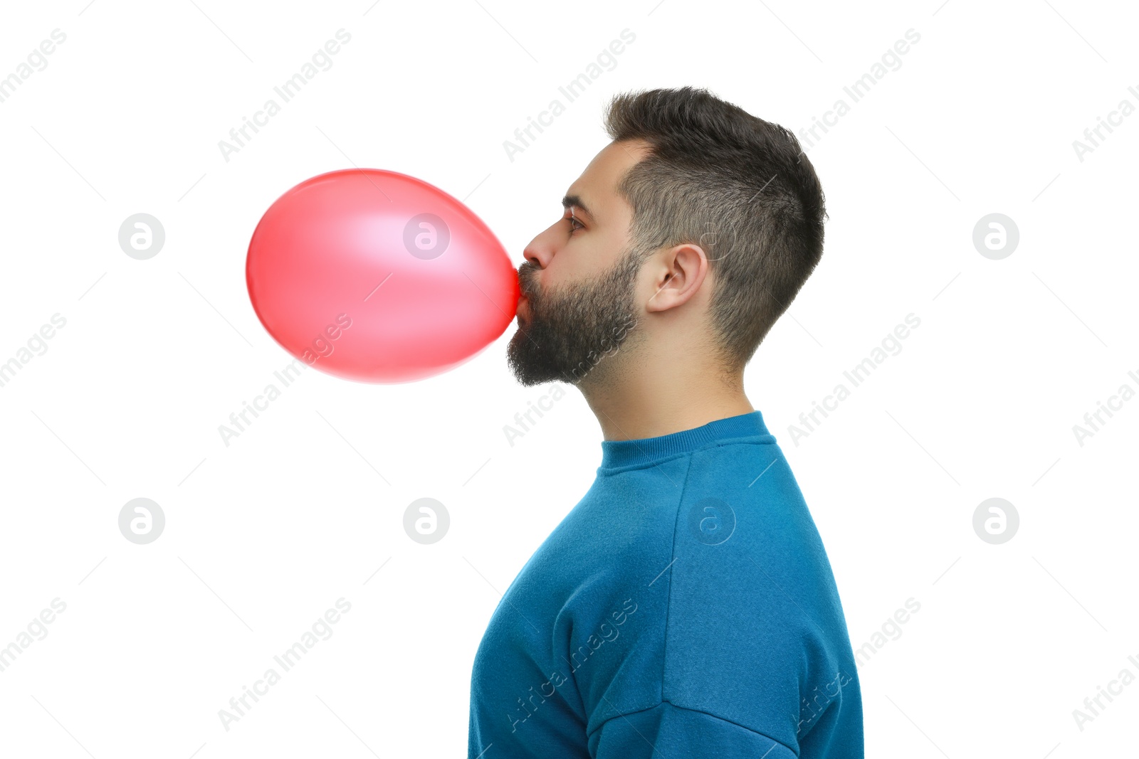 Photo of Man inflating bright balloon on white background