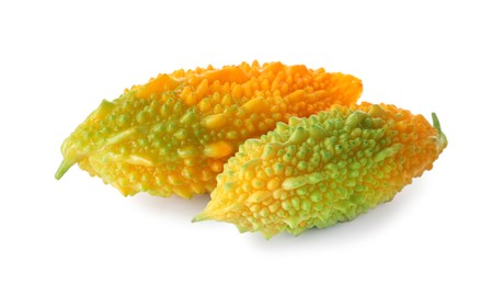 Photo of Fresh ripe bitter melons on white background