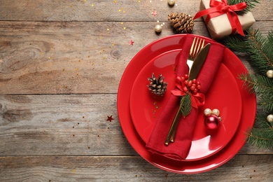 Photo of Beautiful Christmas table setting on wooden background, top view. Space for text