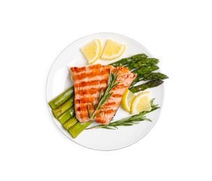 Photo of Tasty grilled salmon with asparagus, lemon and rosemary on white background, top view