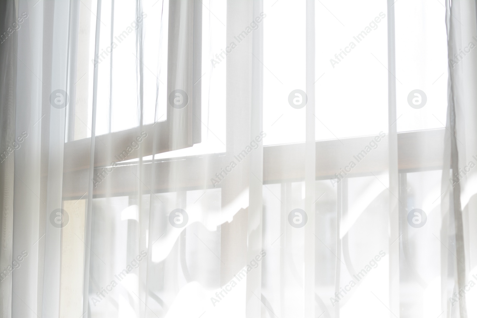 Photo of Window behind white curtain indoors in morning