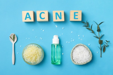 Photo of Cubes with word "Acne" and ingredients for homemade problem skin remedy on color background