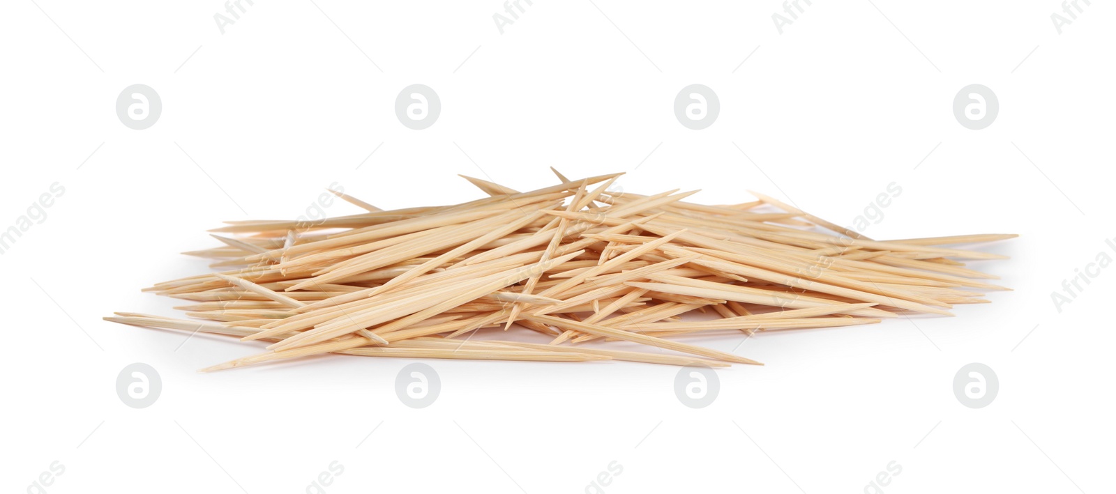 Photo of Heap of wooden toothpicks on white background