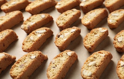 Photo of Traditional Italian almond biscuits (Cantucci) on parchment paper, closeup