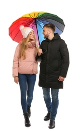 Full length portrait of beautiful couple with umbrella, isolated on white