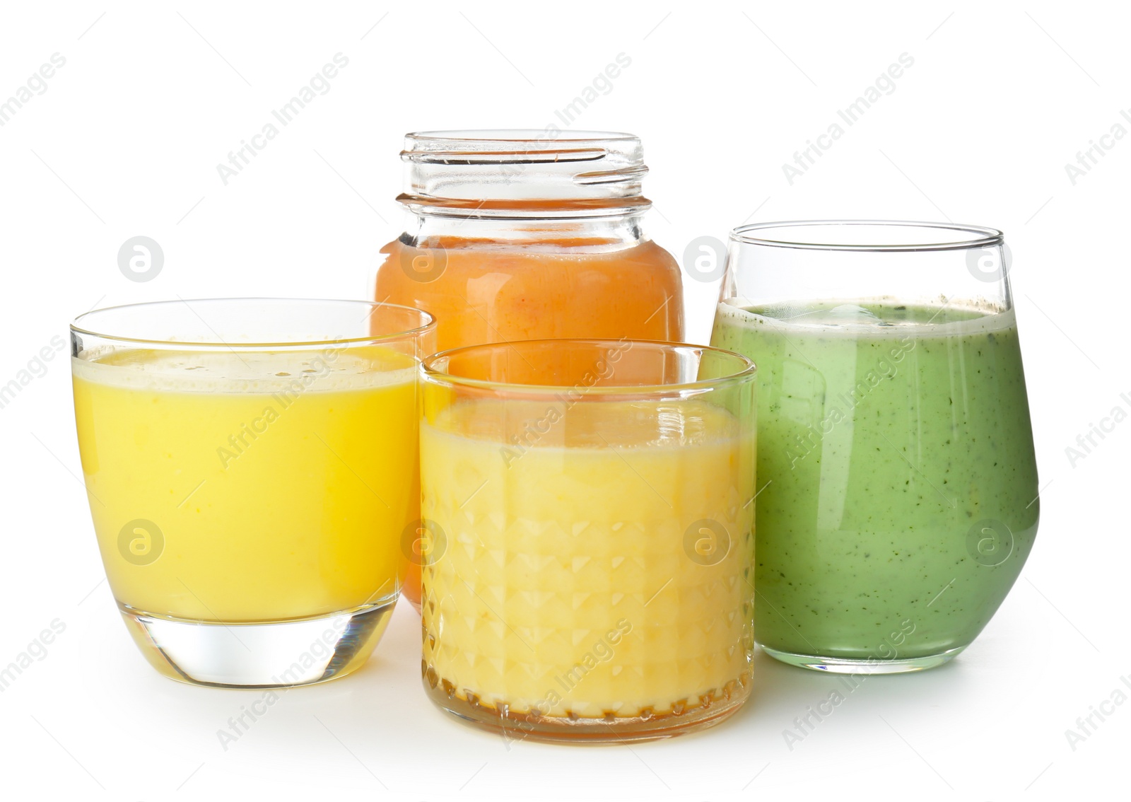 Photo of Glassware with delicious detox smoothies on white background