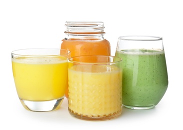 Glassware with delicious detox smoothies on white background