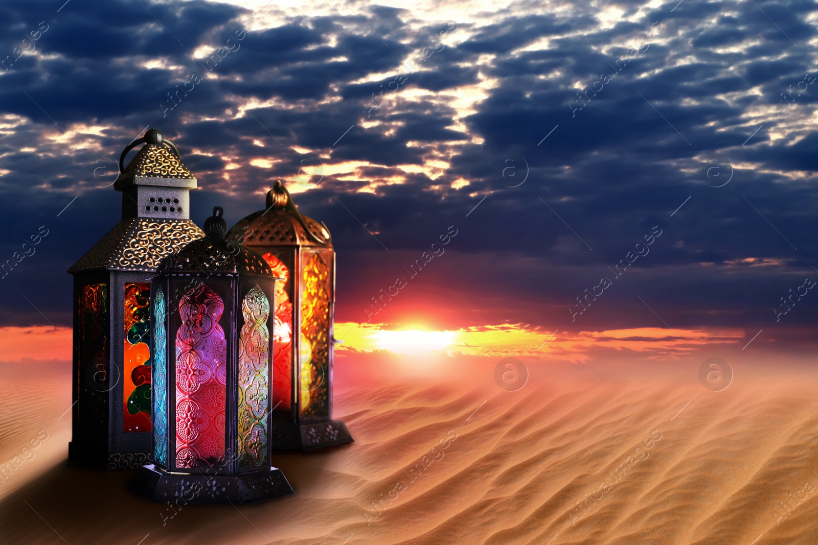 Image of Beautiful Arabic lanterns on sand at sunset, space for text